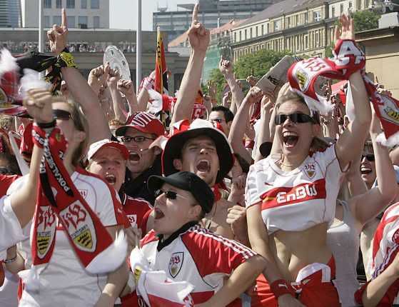 Stuttgart fans observe the Bundesliga match against Energie Cottbus on a screen at the public viewing area \'Schlossplatz\' in Stuttgart, Germany Pictures, Images and Photos