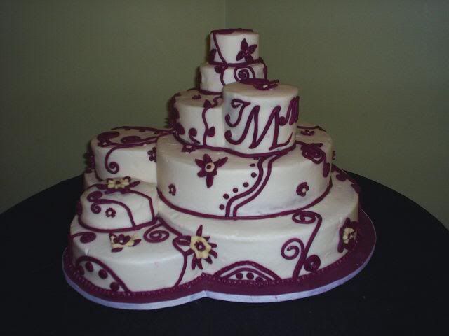 Piece of the Puzzle - This unique wedding cake is composed of 9 different cakes, each cut and pieced together to create the finished look. Pictures, Images and Photos