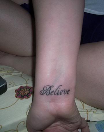 The word Believe on my wrist. And an outline of Texas with a heart on 