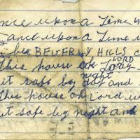 A piece of crumpled notebook paper with a snippet of handwriting on it