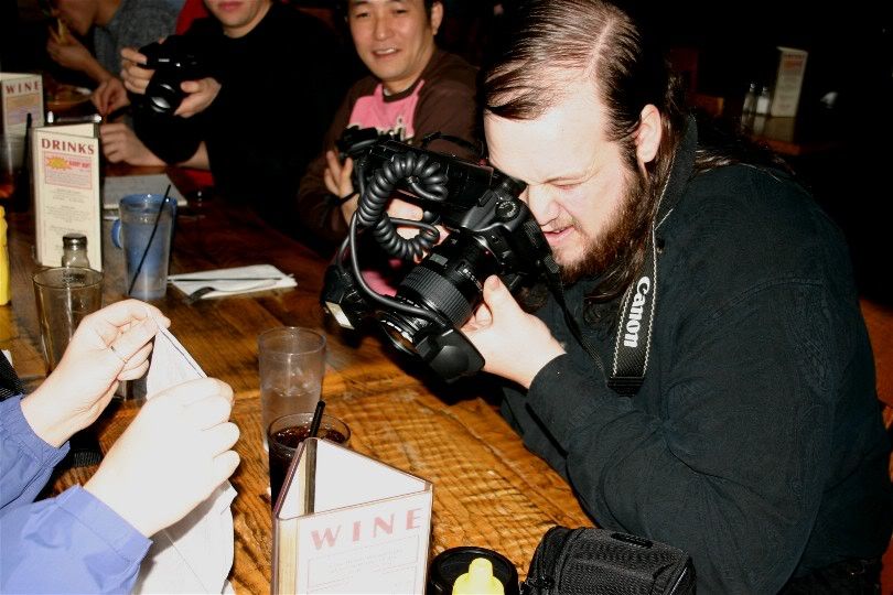 I think we need to add just a few more pieces of equipment to this camera.  Not sure if there is enough there...LOL  Here, a macro lens is being used to capture the ice inside of a soda.  A couple of flashes are attached to the lens to create the perfect lighting.