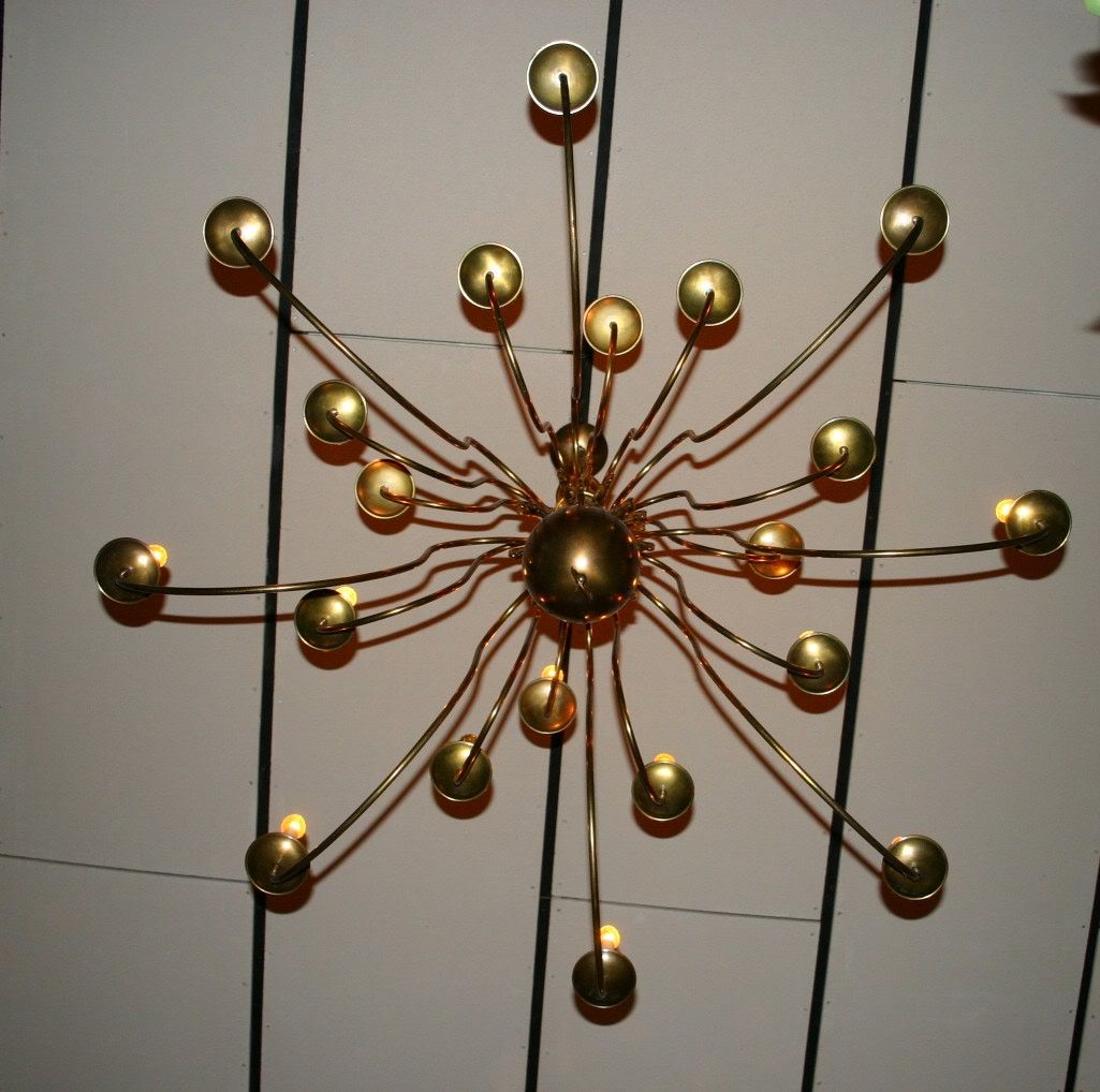 It's a spider, no a suction cup in strings, no....actually, it's a chandelier.  I sat on the floor underneath and caught this photo.