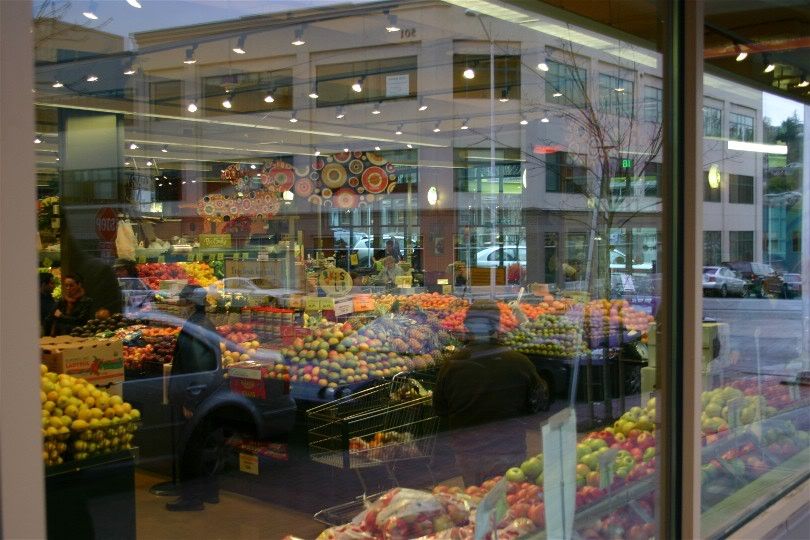 Multiple exposure?  Nope, just a reflection of buildings behind me while photographing the insides of the vegetable area of the corner store.